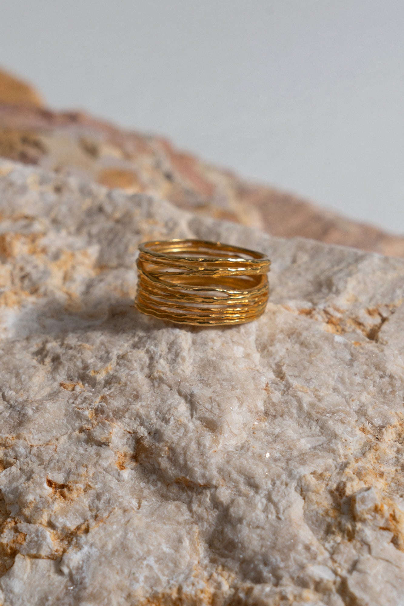 The Woven Cluster Ring